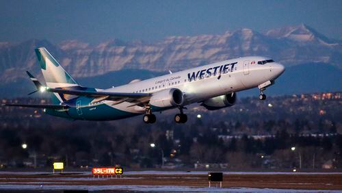 FILE - A wesJet airplane takes off in Calgary, Alta., Jan. 21, 2021.Canadian airline WestJet has begun canceling some flights between Tuesday and Wednesday, June 19, 2024, in anticipation of a strike by aircraft maintenance technicians, saying it wants to avoid having passengers and planes stranded if there is a walkout. (Jeff McIntosh/The Canadian Press via AP)