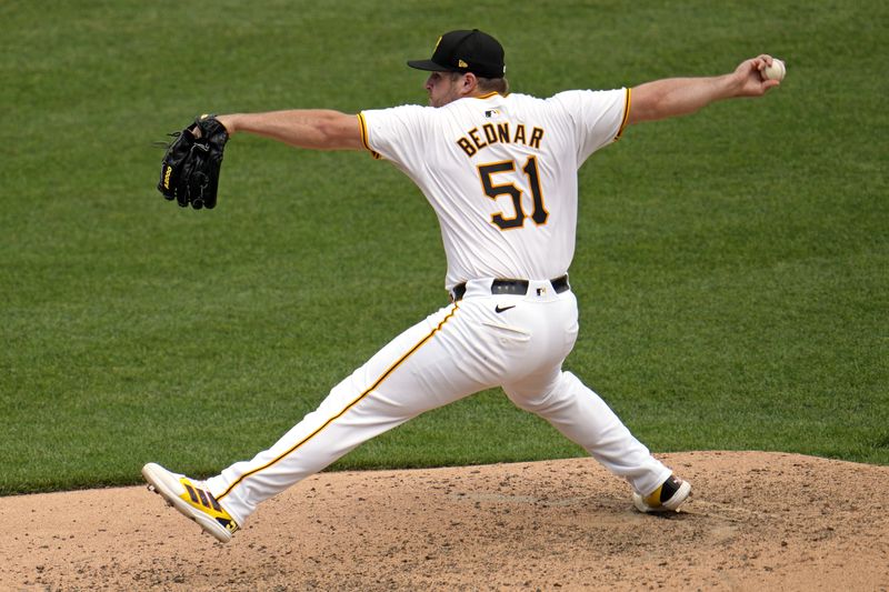 Pittsburgh Pirates relief pitcher David Bednar delivers during the ninth inning of a baseball game against the Cincinnati Reds in Pittsburgh, Wednesday, June 19, 2024. The Pirates won 1-0. (AP Photo/Gene J. Puskar)