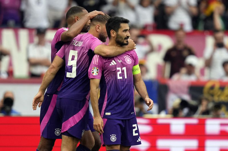 Germany's Ilkay Gundogan (21) celebrates with teammates after scoring his side's second goal during a Group A match between Germany and Hungary at the Euro 2024 soccer tournament in Stuttgart, Germany, Wednesday, June 19, 2024. (AP Photo/Matthias Schrader)