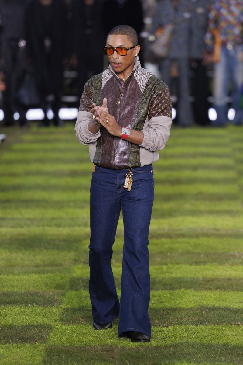 Creative director Pharrell Williams accepts applause following the Louis Vuitton Spring Summer 2025 collection, that was presented in Paris, Tuesday, June 18, 2024. (Photo by Vianney Le Caer/Invision/AP)