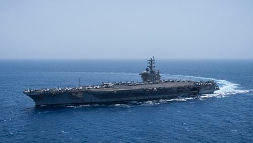 FILE - The USS aircraft carrier Dwight D. Eisenhower, also known as 'IKE', sails in the Red Sea on Wednesday, June 12, 2024. (AP Photo/Bernat Armangue, File)