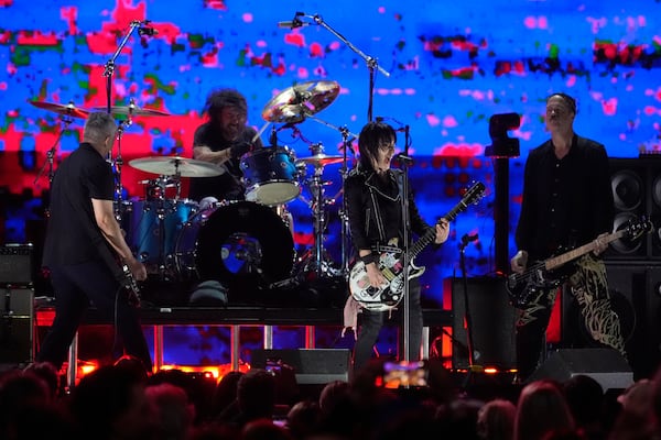 Joan Jett, second from right, performs with Pat Smear, from left, Dave Grohl, and Krist Novoselic of Nirvana during the FireAid benefit concert on Thursday, Jan. 30, 2025, at The Forum in Inglewood, Calif. (AP Photo/Chris Pizzello)