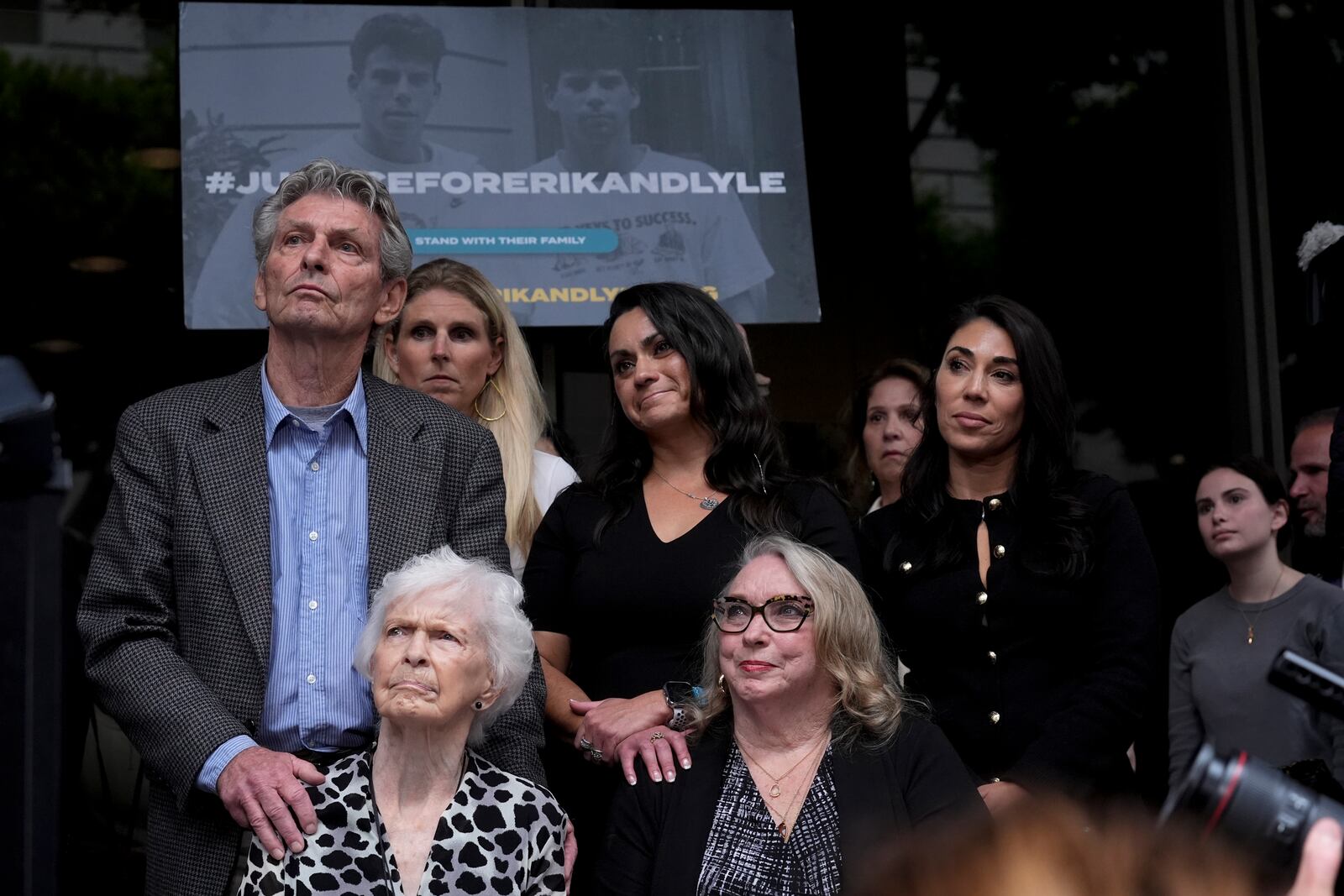 FILE - Kitty Menendez's sister, Joan Andersen VanderMolen, bottom left, and niece Karen VanderMolen, right, sit together during a press conference to announce developments on the case of brothers Erik and Lyle Menendez, Wednesday, Oct. 16, 2024, in Los Angeles. (AP Photo/Damian Dovarganes, File)