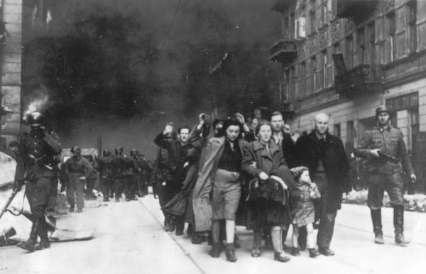 FILE - In this 1943 file photo, a group of Polish Jews are led away for deportation by German SS soldiers during the destruction of the Warsaw Ghetto by German troops after an uprising in the Jewish quarter. (AP Photo, file)