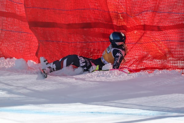 United States' Lindsey Vonn crashes during an alpine ski, women's World Cup downhill training, in Cortina d'Ampezzo, Italy, Thursday, Jan. 16, 2025. (AP Photo/Marco Trovati)