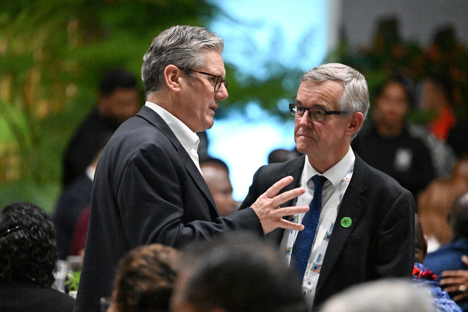 British Prime Minister Keir Starmer, left, attends a State Banquet during the Commonwealth Heads of Government Meeting (CHOGM) in Apia, Samoa, Thursday, Oct. 24, 2024. (William West/Pool Photo via AP)