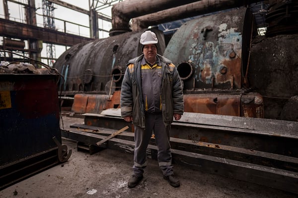 Oleksandr, 52, head of the Production Management Department stands in front of destroyed turbine at DTEK's power plant after a recent Russian missile attack in Ukraine, Nov. 28, 2024. (AP Photo/Evgeniy Maloletka)