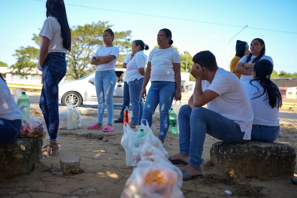 Relatives of prisoners detained in a post-election crackdown wait outside of Tocuyito Prison after a visit, in Tocuyito, Venezuela, Monday, Jan. 20, 2025. (AP Photo/Ariana Cubillos)