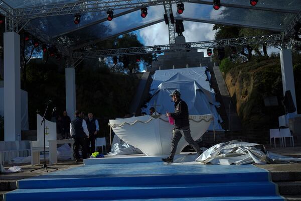 Workers set up the altar prior to Pope Francis' visit, in Ajaccio, in the southern French island of Corsica, Saturday, Dec. 14, 2024. (AP Photo/Thibault Camus)