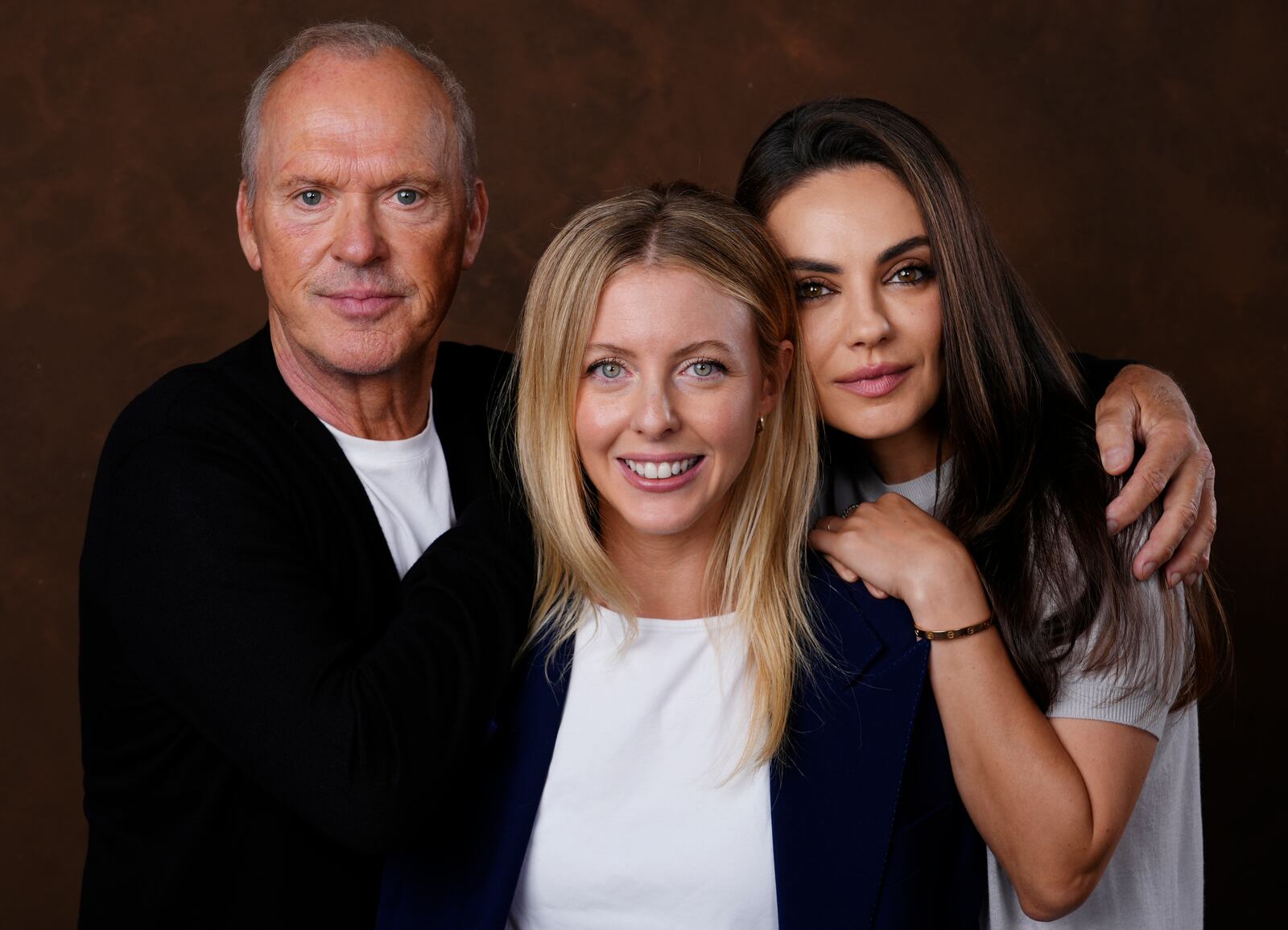 Hallie Meyers-Shyer, center, writer/director of "Goodrich," poses with cast members Michael Keaton, left, and Mila Kunis, Tuesday, Oct. 8, 2024, in Los Angeles. (AP Photo/Chris Pizzello)