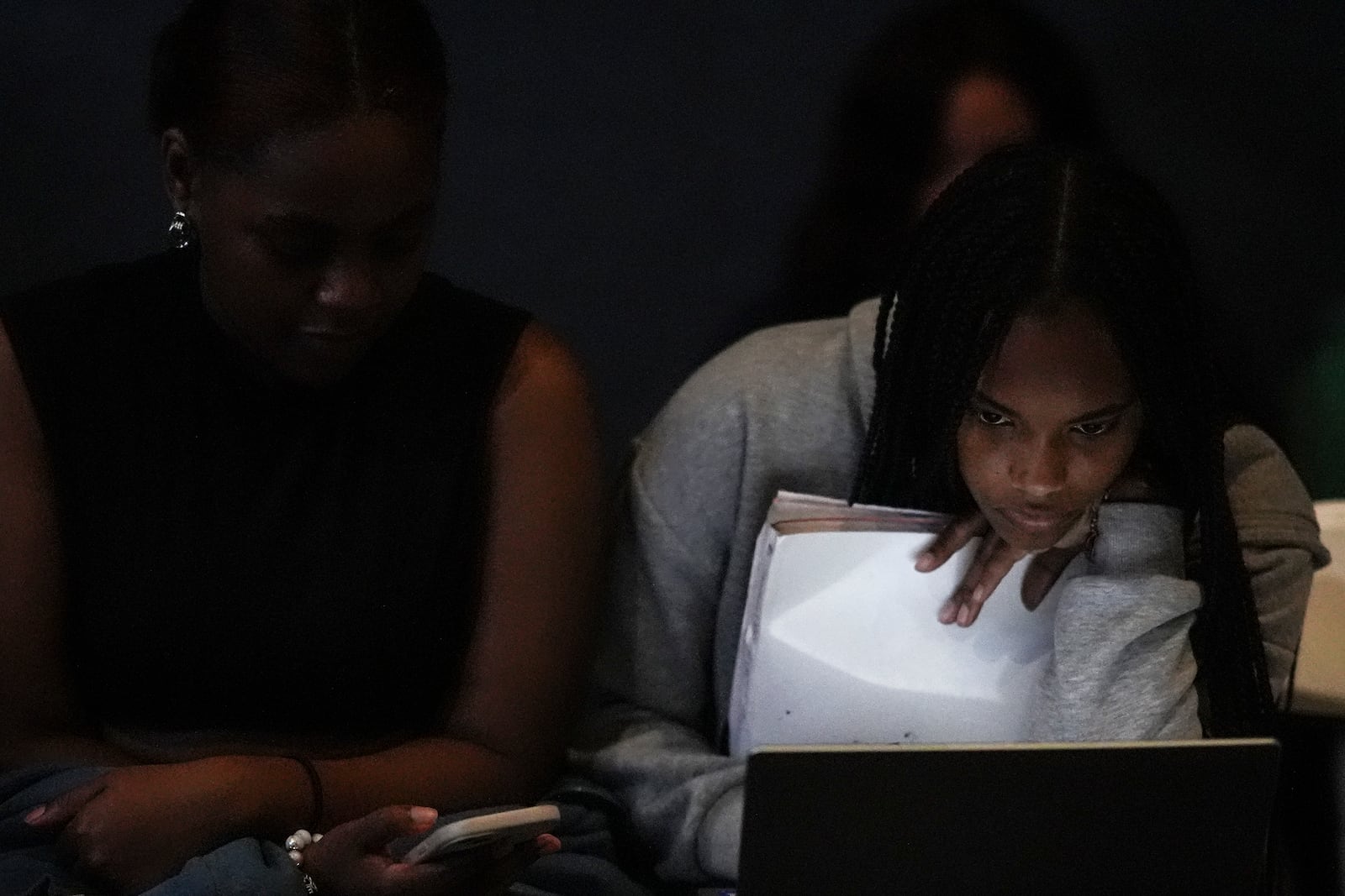 Students watch election coverage at Spelman College, Tuesday, Nov. 5, 2024, in Atlanta. (AP Photo/Brynn Anderson)