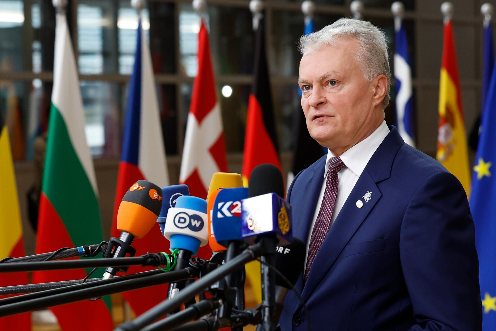 Lithuania's President Gitanas Nauseda talks to journalists as he arrives to an EU summit in Brussels, Thursday, Oct. 17, 2024. (AP Photo/Geert Vanden Wijngaert)