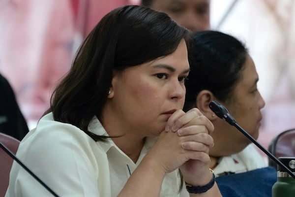 Philippine Vice President Sara Duterte listens as she attends a hearing at the House of Representative in Quezon City, Philippines on Monday Nov. 25, 2024. (AP Photo/Aaron Favila)