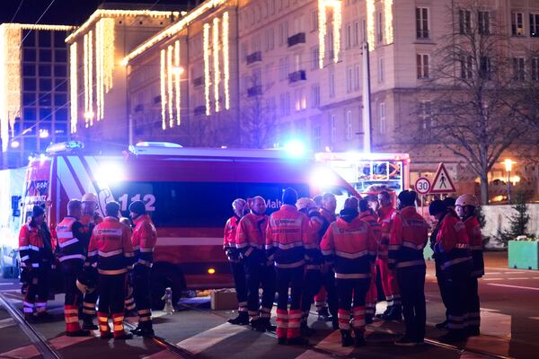 Emergency services work in a cordoned-off area near a Christmas Market, after a car drove into a crowd in Magdeburg, Germany, Friday, Dec. 20, 2024. (AP Photo/Ebrahim Noroozi)