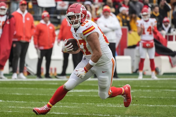 Kansas City Chiefs tight end Travis Kelce (87) runs against the Pittsburgh Steelers during the first half of an NFL football game, Wednesday, Dec. 25, 2024, in Pittsburgh. (AP Photo/Gene J. Puskar)