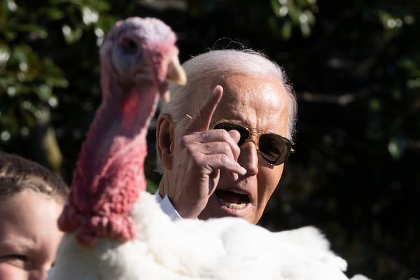 President Joe Biden pardons one of the national Thanksgiving turkeys, Peach, during a ceremony on the South Lawn of the White House in Washington, Monday, Nov. 25, 2024. (AP Photo/Mark Schiefelbein)