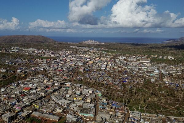 Drone view of destroyed dwellings in Mirereni, Mayotte, Friday, Dec. 20, 2024. (AP Photo/Adrienne Surprenant)