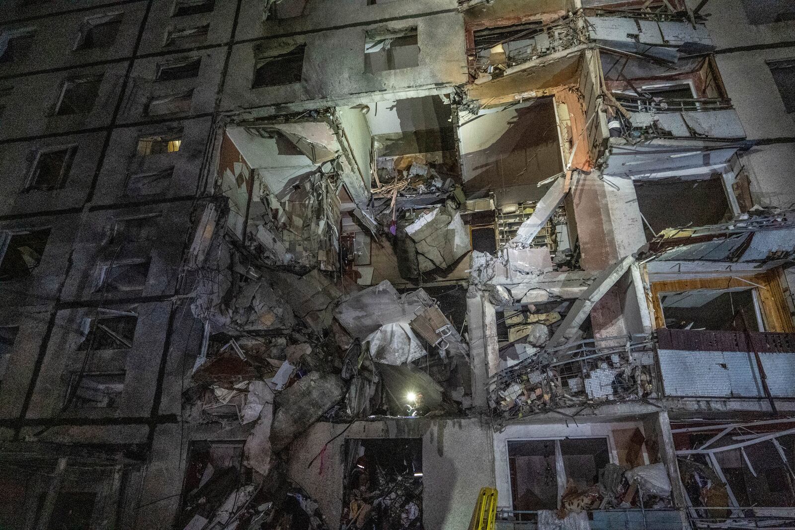 A multi-storey apartment building is seen damaged by the Russian attack in Kharkiv, Ukraine, late Wednesday, Oct. 30, 2024. (AP Photo/Andrii Marienko)