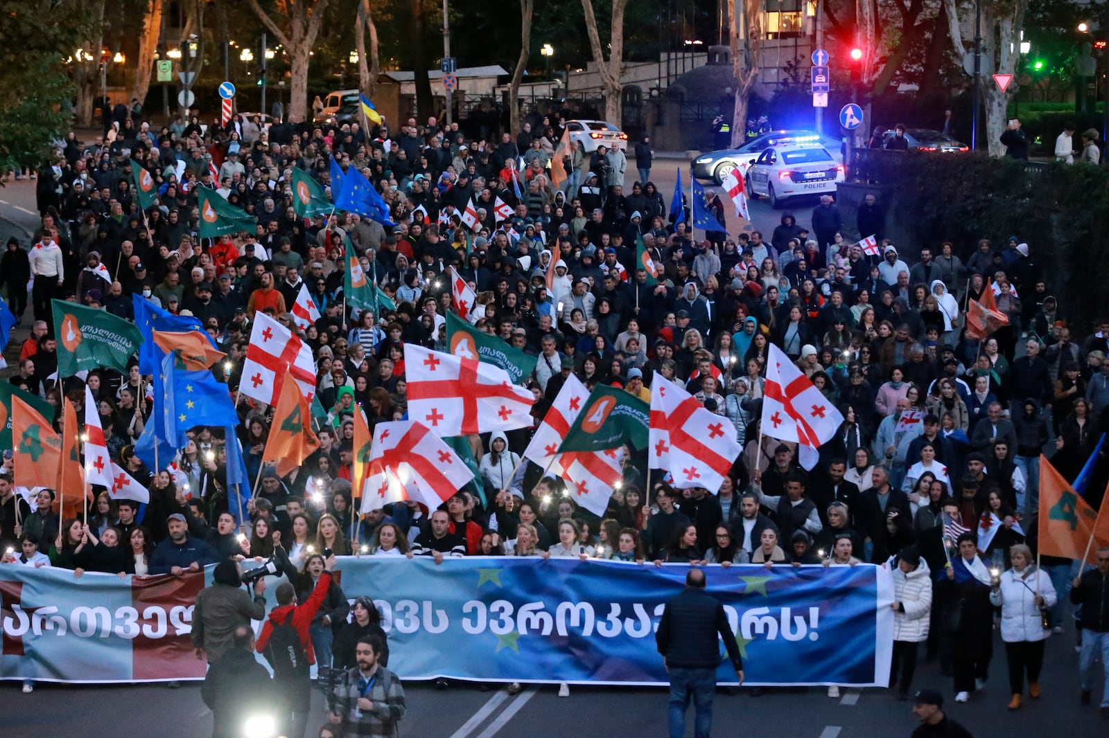 Demonstrators march during an opposition rally ahead upcoming next week parliamentary election in Tbilisi, Georgia, Sunday, Oct. 20, 2024. (AP Photo/Zurab Tsertsvadze)