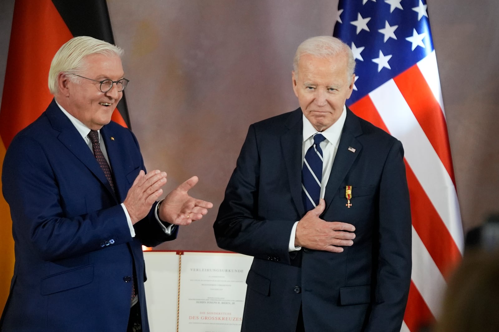 President Joe Biden receives Germany's Grand Cross special class of the Order of Merit by German President Frank-Walter Steinmeier at Bellevue Palace in Berlin, Germany, Friday, Oct. 18, 2024. (AP Photo/Matthias Schrader)