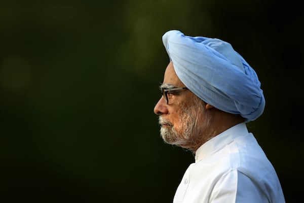 FILE - In this Wednesday, May 21, 2014 file photo, outgoing Indian prime minister Manmohan Singh leaves after paying homage to former Indian prime minister Rajiv Gandhi on his death anniversary, in New Delhi, India. (AP Photo/Manish Swarup, File)