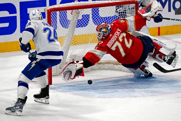 FILE - Florida Panthers goaltender Sergei Bobrovsky (72) blocks a shot by Tampa Bay Lightning defenseman Matt Dumba (24) during the second period of Game 2 of the first-round of an NHL Stanley Cup Playoff series, Tuesday, April 23, 2024, in Sunrise, Fla. (AP Photo/Wilfredo Lee, File)