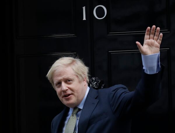 FILE - Britain's Prime Minister Boris Johnson returns to 10 Downing Street after meeting with Queen Elizabeth II at Buckingham Palace, London, on Friday, Dec. 13, 2019. (AP Photo/Matt Dunham, File)