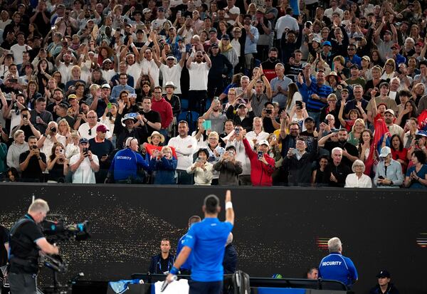 Novak Djokovic of Serbia gestures to the crowd after defeating Tomas Machac of the Czech Republic during their third round match at the Australian Open tennis championship in Melbourne, Australia, Friday, Jan. 17, 2025. (AP Photo/Asanka Brendon Ratnayake)