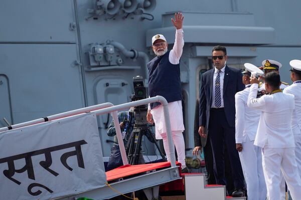 Indian Prime Minister Narendra Modi greets after the commissioning of INS Surat at a naval dockyard in Mumbai,, India, Wednesday, Jan. 15, 2025. (AP Photo/Rafiq Maqbool)