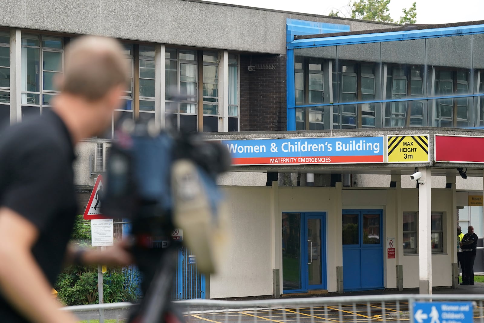 FILE - Members of the media work outside the Countess of Chester Hospital in Chester, England, Aug. 18, 2023. (Jacob King/Pool photo via AP)