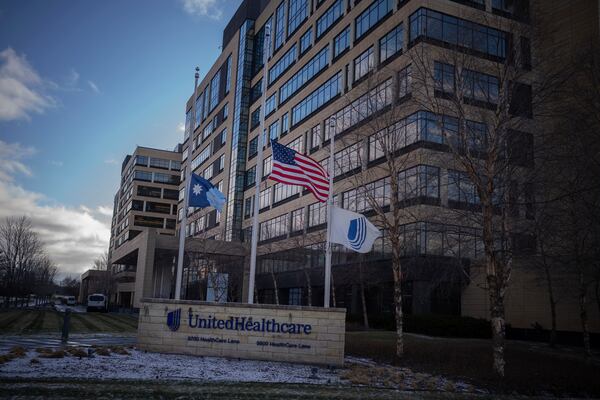 Flags fly at half mast in front of UnitedHealthcare headquarters in Minnetonka, Minn., Wednesday Dec. 4, 2024, after its CEO Brian Thompson was shot and killed in New York City. (Jerry Holt/Star Tribune via AP)