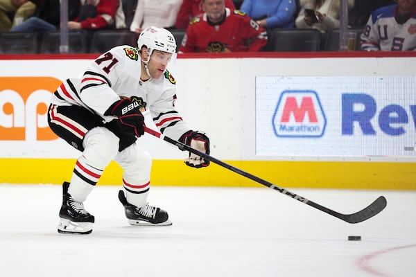 Chicago Blackhawks forward Taylor Hall. skates the puck upice in the first period of an NHL hockey game against the Detroit Red Wings, Friday, Jan. 10, 2025, in Detroit. (AP Photo/Mike Mulholland)