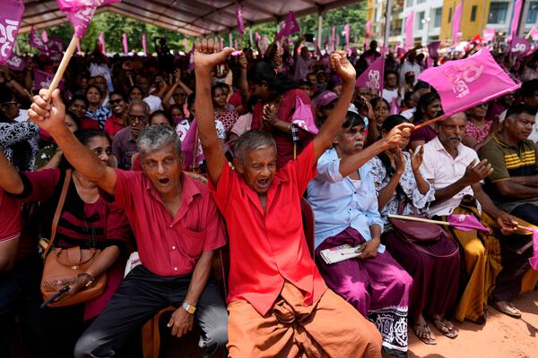 Supporters of National People's Power cheer their leader and presidential candidate Anura Kumara Dissanayake during a public rally in Dehiowita, Sri Lanka, Tuesday, Sept. 17, 2024. (AP Photo/Eranga Jayawardena)