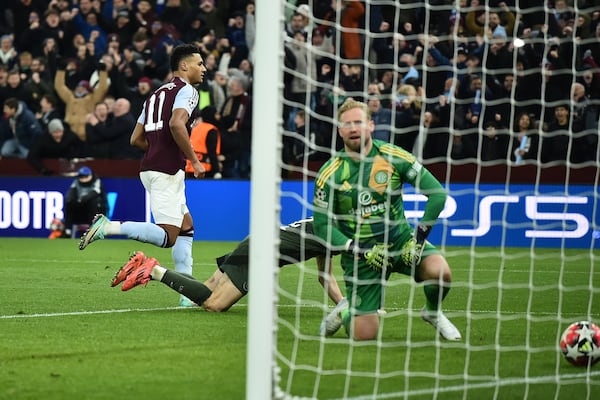 Aston Villa's Ollie Watkins, background, celebrates after scoring his side's third goal during the Champions League opening phase soccer match between Aston Villa and Celtic at Villa Park in Birmingham, England, Wednesday, Jan. 29, 2025. (AP Photo/Rui Vieira)