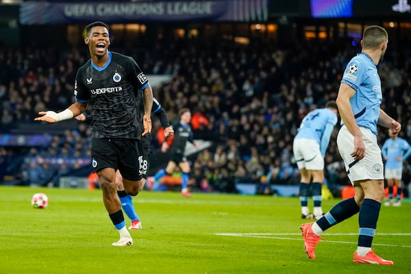 Brugge's Raphael Onyedika celebrates after scoring the opening goal during the Champions League opening phase soccer match between Manchester City and Club Brugge at the Etihad Stadium in Manchester, Wednesday, Jan. 29, 2025. (AP Photo/Dave Thompson)