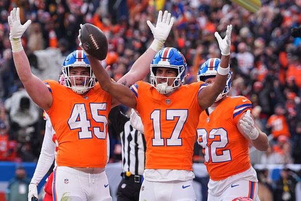 Denver Broncos wide receiver Devaughn Vele (17) celebrates after catching a touchdown pass during the first half of an NFL football game against the Kansas City Chiefs Sunday, Jan. 5, 2025, in Denver. (AP Photo/David Zalubowski)