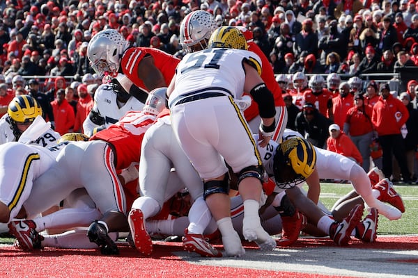 Michigan's Kalel Mullings (20) scores a touchdown against Ohio State during the first half of an NCAA college football game Saturday, Nov. 30, 2024, in Columbus, Ohio. (AP Photo/Jay LaPrete)