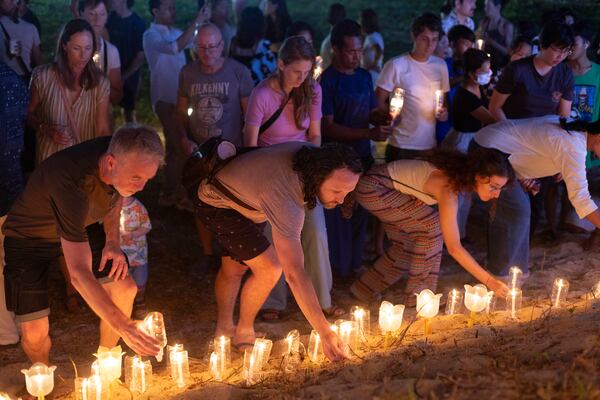 Relatives of victims of the 2004 Indian Ocean tsunami hold a candle light vigil as they participate in the 20th anniversary, at Tsunami Memorial Park at Ban Nam Khem, Takuapa district of Phang Nga province, southern Thailand, Thursday, Dec. 26, 2024. (AP Photo/Wason Wanichakorn)