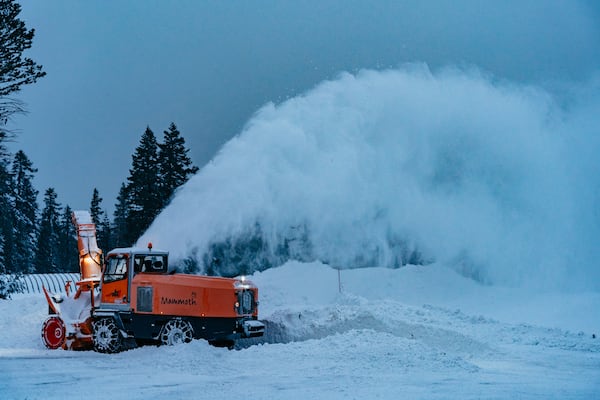 In this photo provided by Mammoth Mountain, snow is cleared as it piles up during a storm Sunday, Nov. 24, 2024, in Mammoth Lakes, Calif. (Cody Mathison/Mammoth Mountain via AP)