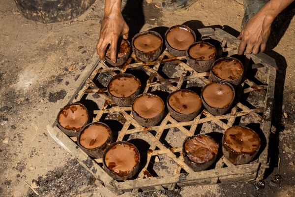 Amal Susanto makes palm sugar at his house on Kabaena Island, Southeast Sulawesi, Indonesia, Friday, Friday, Nov. 15, 2024. (AP Photo/Yusuf Wahil)