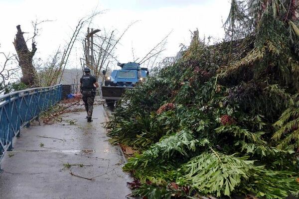 This photo provided on Monday Dec.16, 2024 by the Gendarmerie Nationale, shows an armored vehicle of the Gendarmerie Nationale clearing a road Sunday, Dec. 15, 2024 in Mayotte as France rushed rescue teams and supplies to its largely poor overseas department in the Indian Ocean that has suffered widespread destruction. (Gendarmerie Nationale via AP)