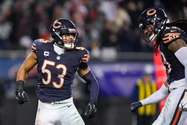 Chicago Bears linebackers T.J. Edwards (53) and Tremaine Edmunds (49) react after a play against the Seattle Seahawks during the second half of an NFL football game, Thursday, Dec. 26, 2024, in Chicago. (AP Photo/Erin Hooley)