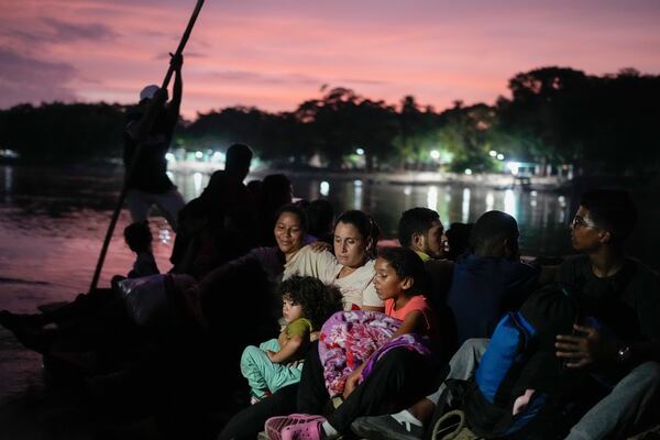 FILE - Venezuelan migrant Lisbeth Contreras and her children cross the Suchiate River on a raft from Tecun Uman, Guatemala, into Mexico, Oct. 26, 2024, as they make their way to the U.S. (AP Photo/Matias Delacroix, File)