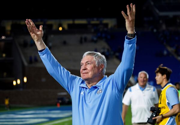 FILE - North Carolina coach Mack Brown gestures to fans after the team's win over Duke in an NCAA college football game in Durham, N.C., Saturday, Oct. 15, 2022. (AP Photo/Ben McKeown, File)