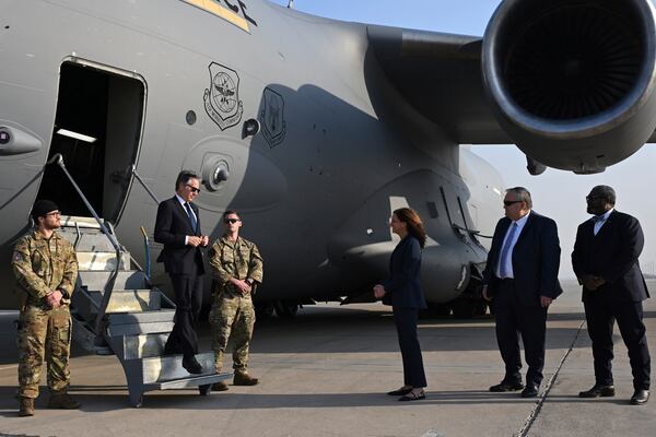 US Secretary of State Antony Blinken, second left, is welcomed by US officials upon landing in Baghdad, Iraq, Friday, Dec. 13, 2024. (Andrew Caballero-Reynolds/Pool Photo via AP)