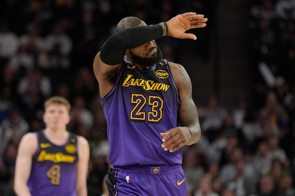 Los Angeles Lakers forward LeBron James (23) walks downcourt during the second half of an NBA basketball game against the Minnesota Timberwolves, Monday, Dec. 2, 2024, in Minneapolis. (AP Photo/Abbie Parr)