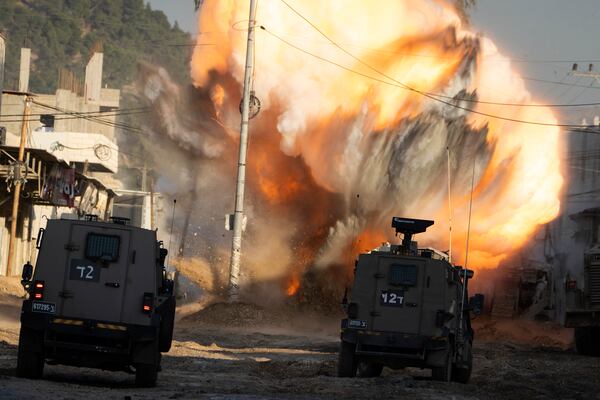 An explosive devise planted by Palestinian militants explodes after being detonated by Israeli soldiers during a military raid in the Nur Shams refugee camp near the West Bank city of Tulkarem, Tuesday, Dec. 24, 2024. (AP Photo/Majdi Mohammed)