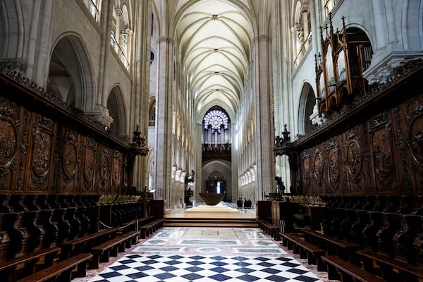 The choir stalls of Notre-Dame de Paris cathedral are seen while French President Emmanuel Macron visits the restored interiors of the monument, Friday Nov. 29, 2024, in Paris. (Stephane de Sakutin, Pool via AP)