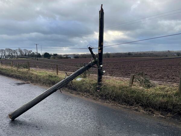 A broken telegraph pole on Blaris Road, Co Antrim, Ireland, as Storm Eowyn hits the country, Friday Jan. 24, 2025. (Jonathan McCambridge/PA via AP)