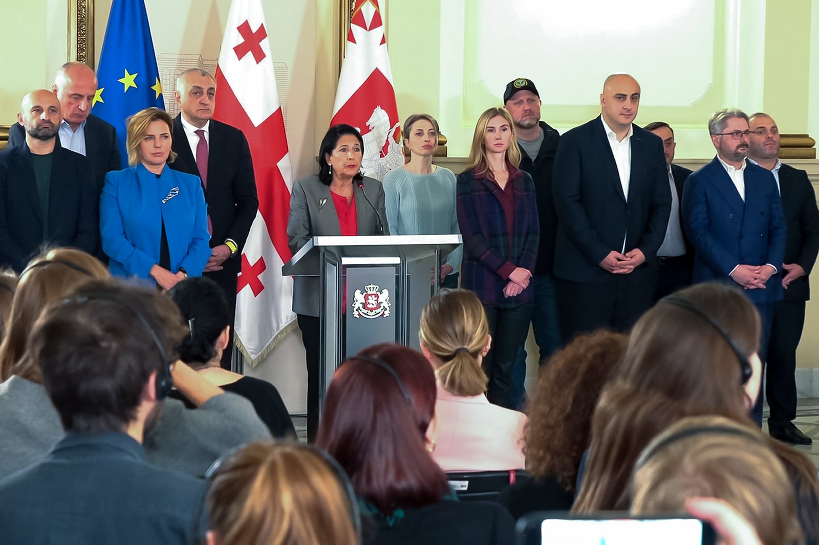 In this photo taken from video, Georgian President Salome Zourabichvili, center, surrounded by opposition leaders speaks to the media after the parliamentary election in Tbilisi, Georgia, on Sunday, Oct. 27, 2024. (AP Photo/Kostya Manenkov)